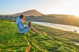 woman using laptop in the wild